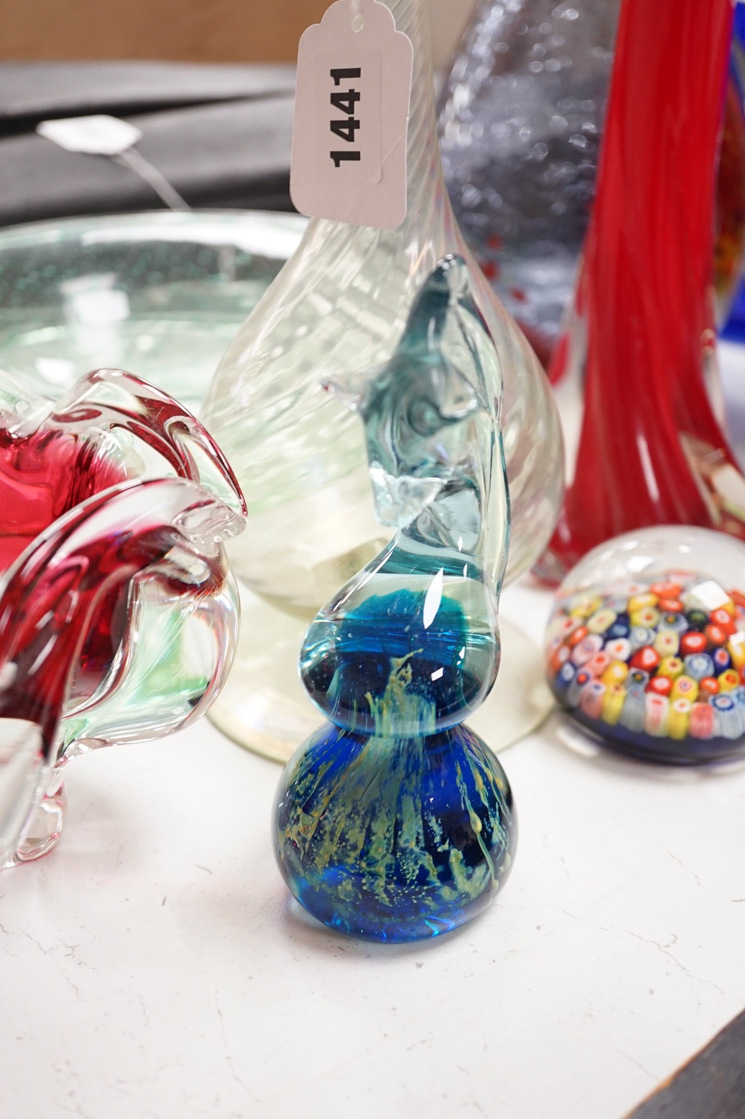 A large group of mixed art glass and other coloured glass vases, bowls, paperweights and two stoppered bottles etc, tallest 65cms high